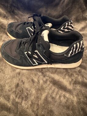 New Balance Women’s 574 'Zebra Black' sneakers  zebra-striped heel tab Size 7.5
